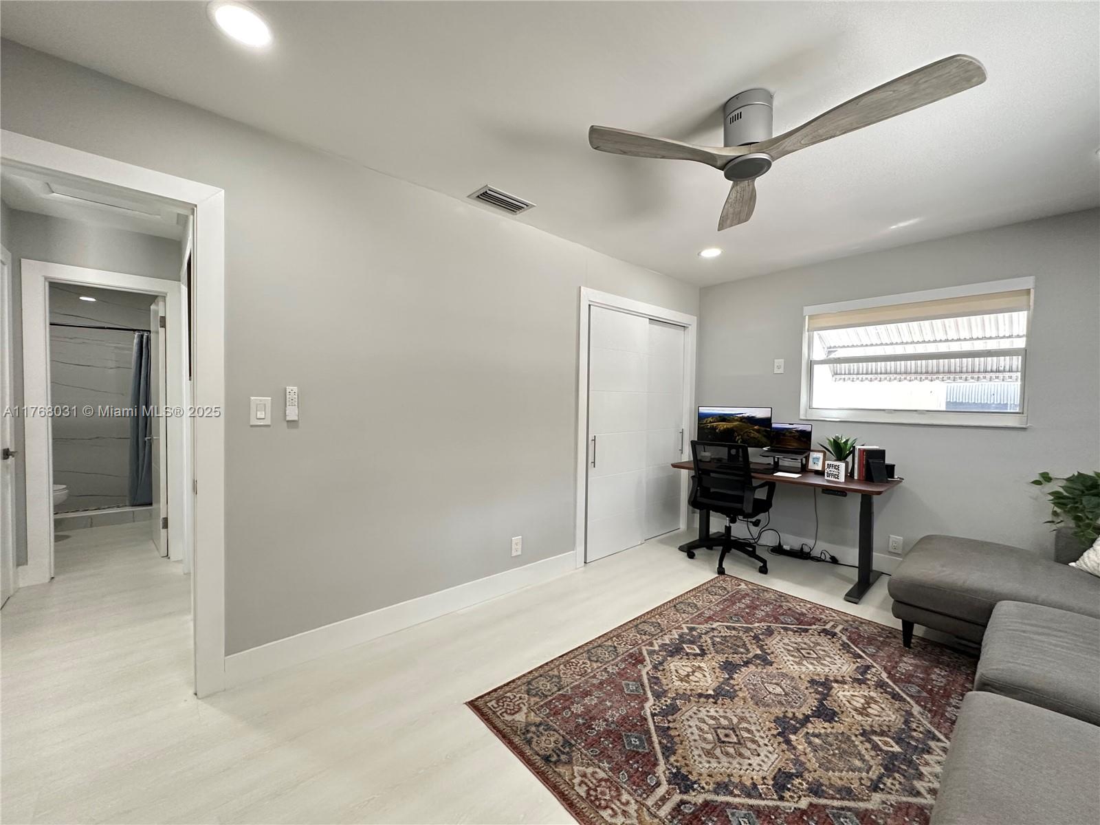 2001 North 31st Road Hollywood, FL 33021 - Photo 25 of 75 a living room with furniture and a rug