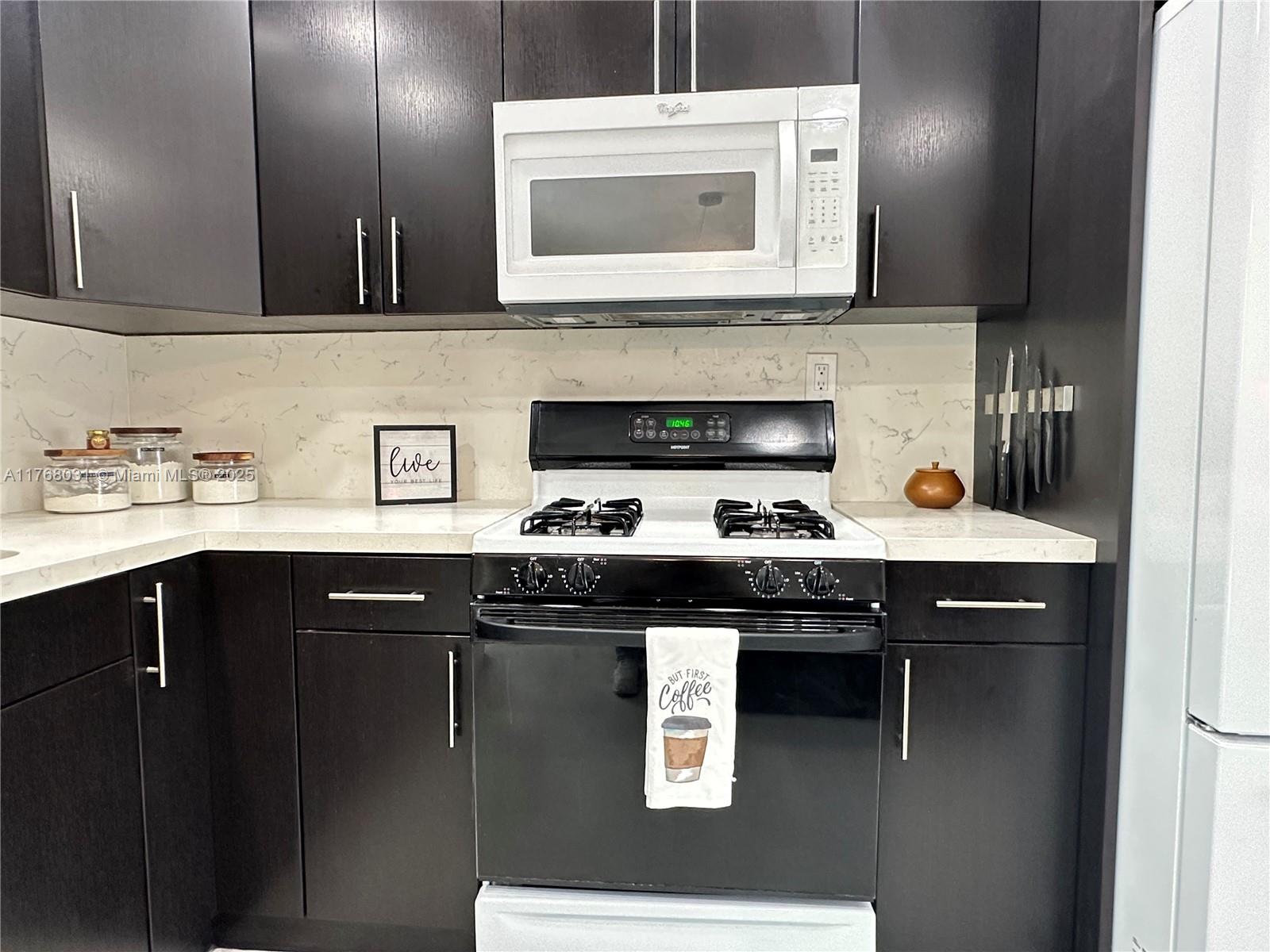 2001 North 31st Road Hollywood, FL 33021 - Photo 36 of 75 a kitchen with a sink and cabinets