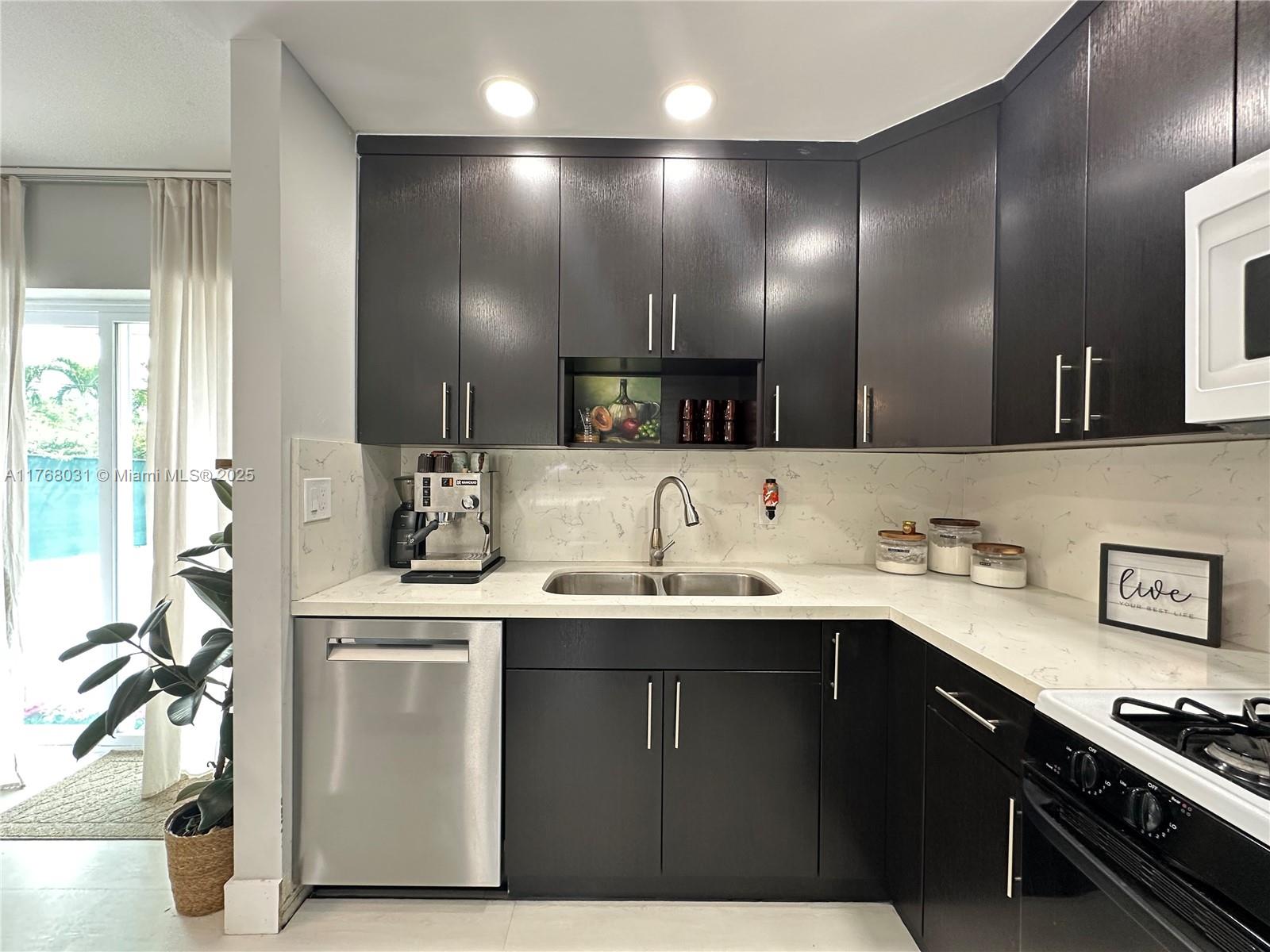 2001 North 31st Road Hollywood, FL 33021 - Photo 39 of 75 a kitchen with a sink and cabinets