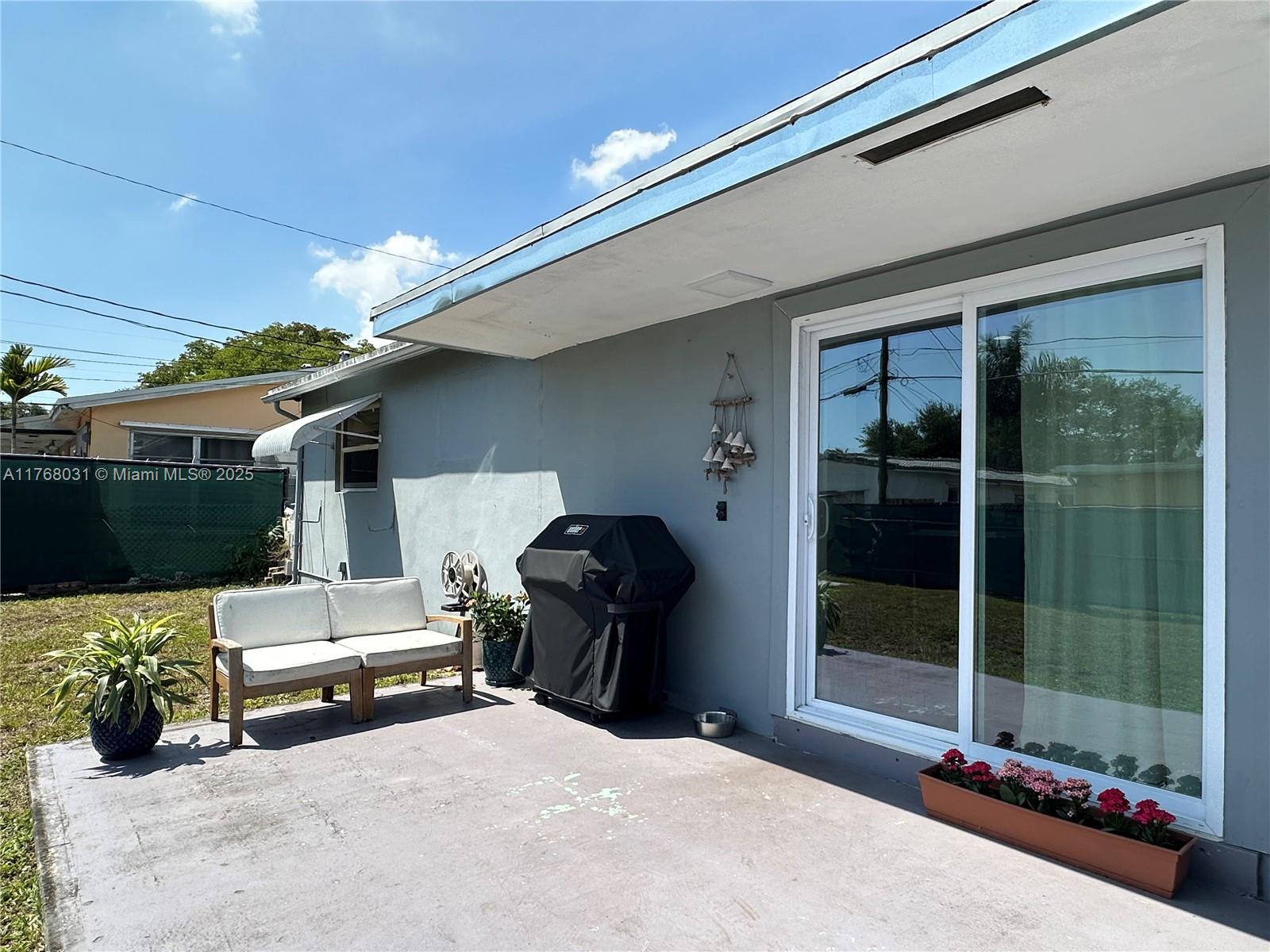 2001 North 31st Road Hollywood, FL 33021 - Photo 48 of 75 a bedroom with furniture and large window