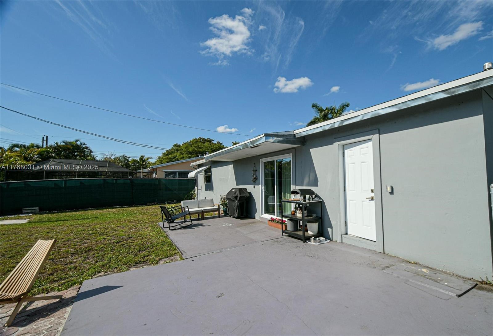 2001 North 31st Road Hollywood, FL 33021 - Photo 49 of 75 a view of a chair and tables in patio