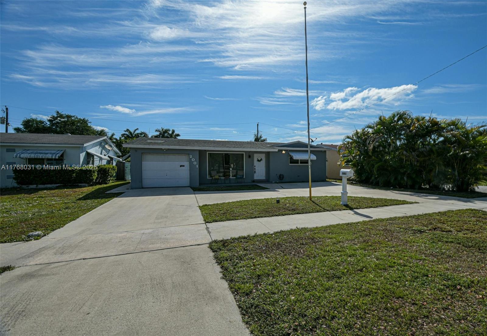 2001 North 31st Road Hollywood, FL 33021 - Photo 62 of 75 a view of a house with a backyard and a garden