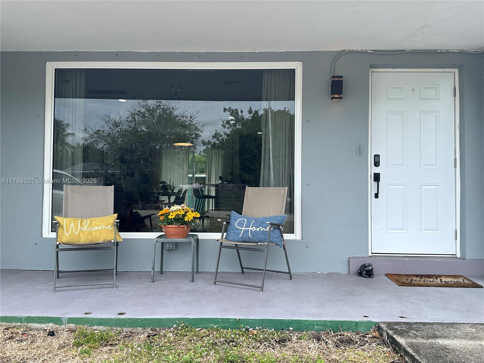 2001 North 31st Road Hollywood, FL 33021 - Photo 7 of 75 a living room with furniture and a window