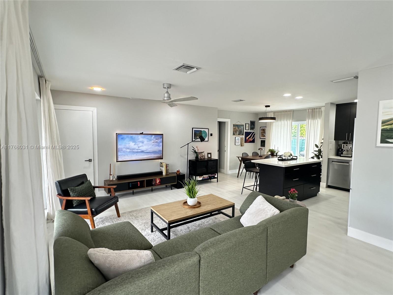 2001 North 31st Road Hollywood, FL 33021 - Photo 8 of 75 a living room with furniture kitchen view and a large window