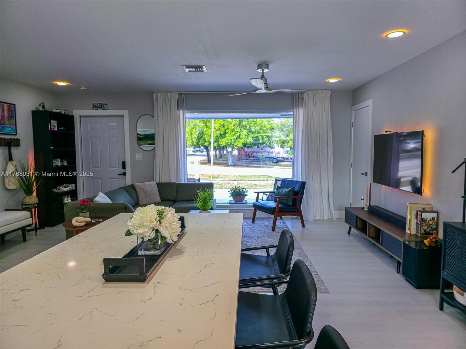 2001 North 31st Road Hollywood, FL 33021 - Photo 10 of 75 a living room with furniture and a flat screen tv