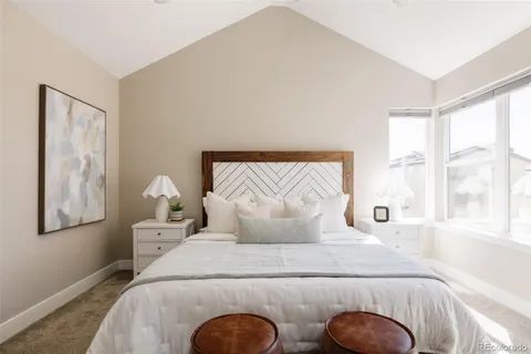a bedroom with bed and window