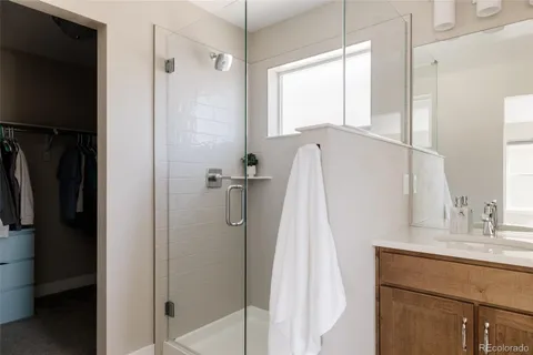 a bathroom with a sink vanity and a mirror