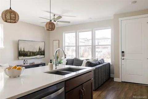 a kitchen with a sink a counter space and a window