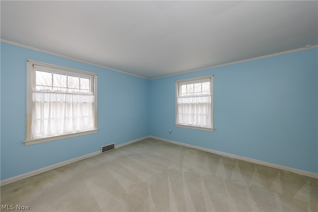 1050 Renfield Road Cleveland Heights, OH 44121 - Photo 29 of 41 Empty bedroom with light colored carpet and crown molding