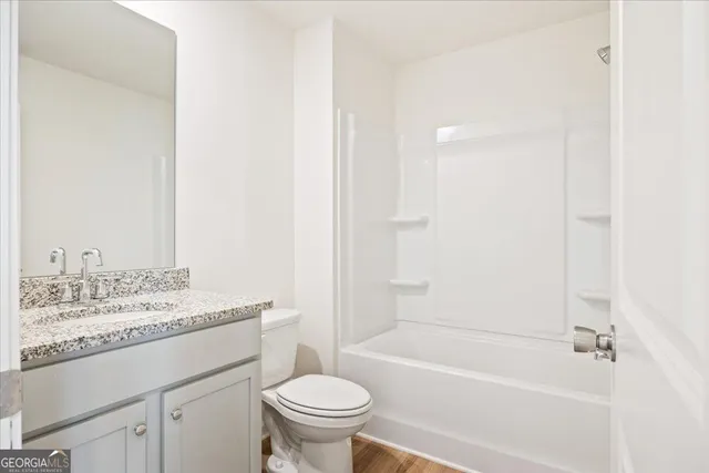 a bathroom with a sink toilet and bathtub