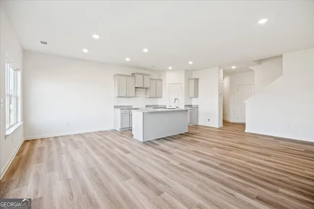 a view of kitchen with wooden floor