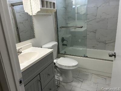 353 Woodbridge Drive Ridge, NY 11961 - Photo 7 of 11 a bathroom with a sink toilet and shower