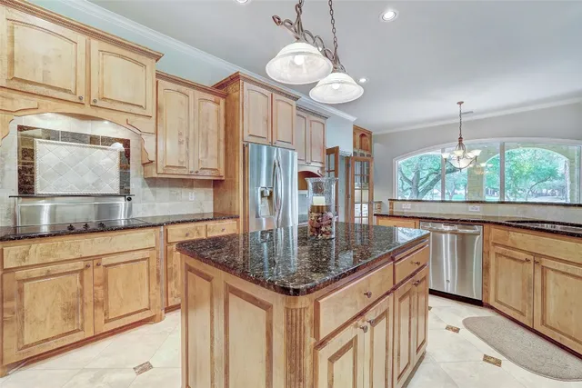 a living room filled with furniture and a large window