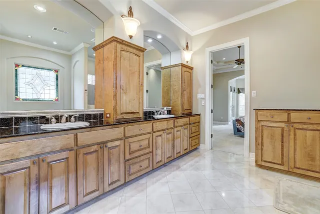 a living room with furniture a chandelier and a window