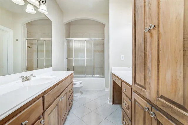 a bathroom with a sink vanity and a mirror