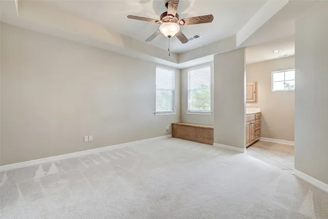 a bathroom with a shower and a toilet