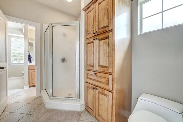 a room with furniture pool table and windows