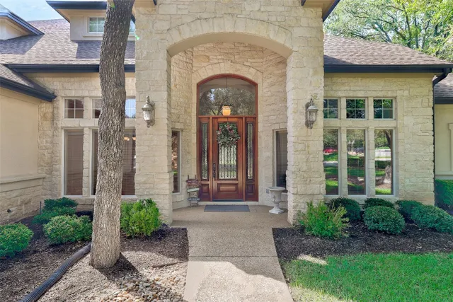 a view of a brick house with a large windows