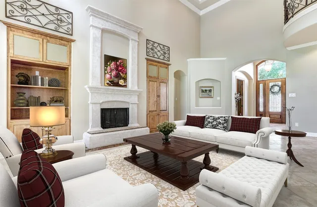 a living room with furniture windows and a fireplace