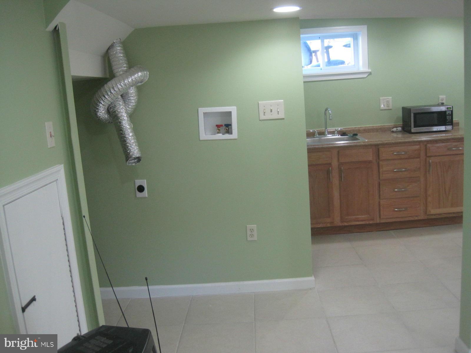 6517 Red Top Road Hyattsville, MD 20783 - Photo 23 of 23 a bathroom with a sink a toilet and vanity