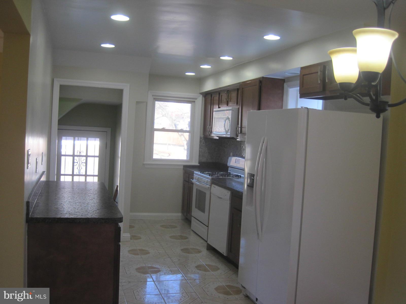 6517 Red Top Road Hyattsville, MD 20783 - Photo 10 of 23 a kitchen with refrigerator and window
