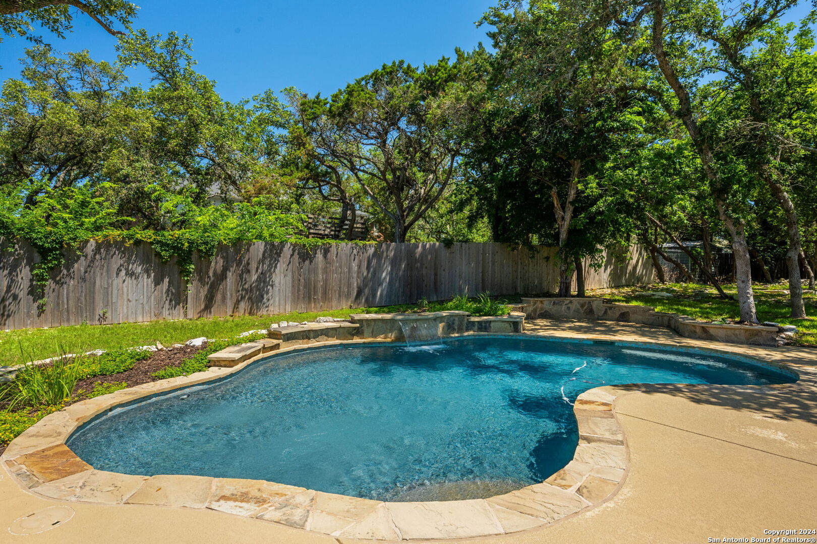 a view of swimming pool having patio