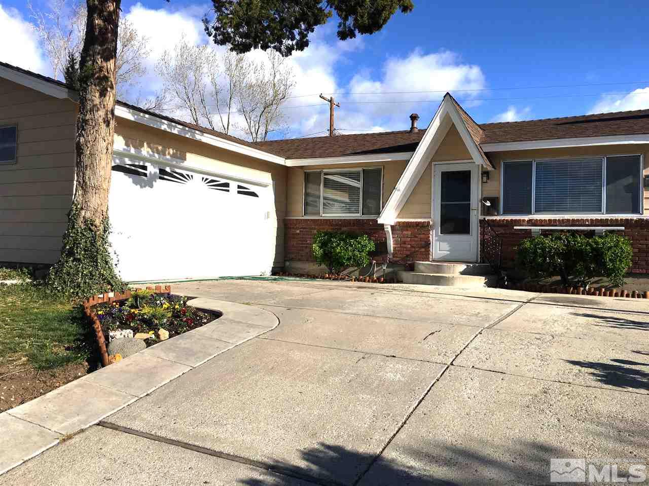 1835 West 6th Street Reno, NV 89503 - Photo 1 of 1 a front view of a house with a yard and outdoor seating