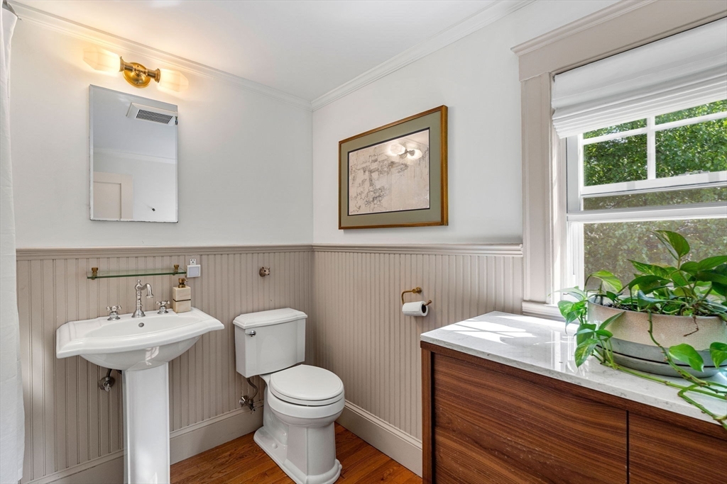 34 Avalon Road Milton, MA 02186 - Photo 32 of 42 a bathroom with a toilet sink and mirror