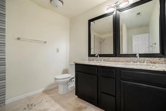 a bathroom with a sink and a toilet