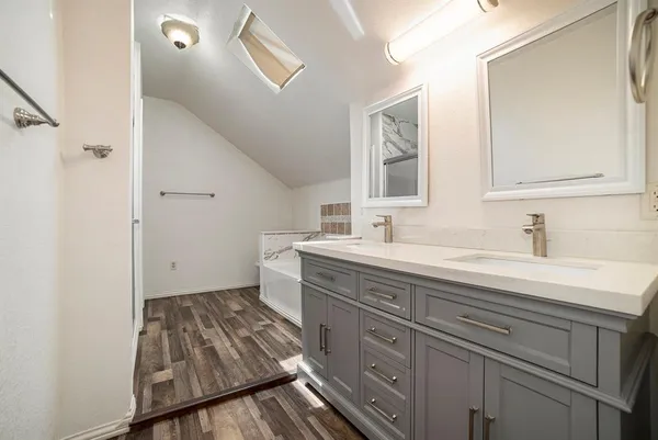 a bathroom with a sink and a mirror