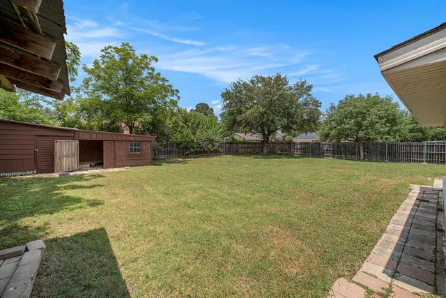 a view of a backyard with a garden