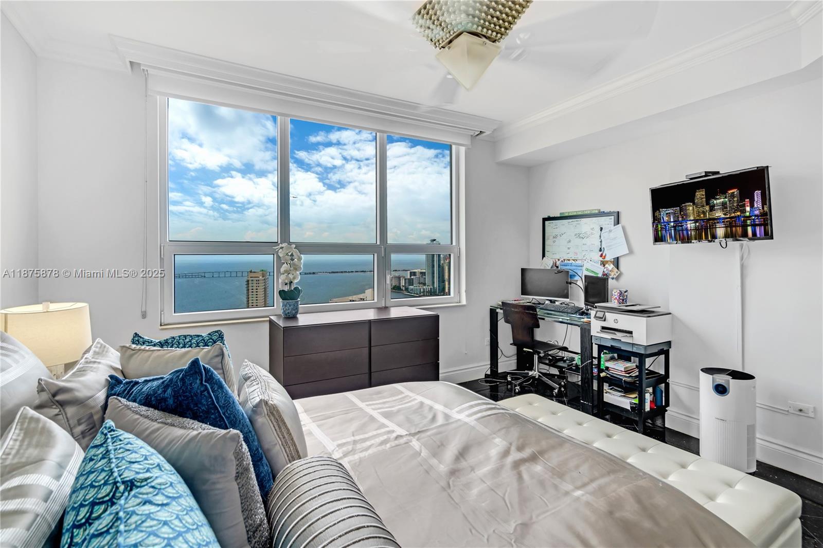 848 Brickell Key Drive, Unit 3803 Miami, FL 33131 - Photo 36 of 42 a bedroom with a bed and a window
