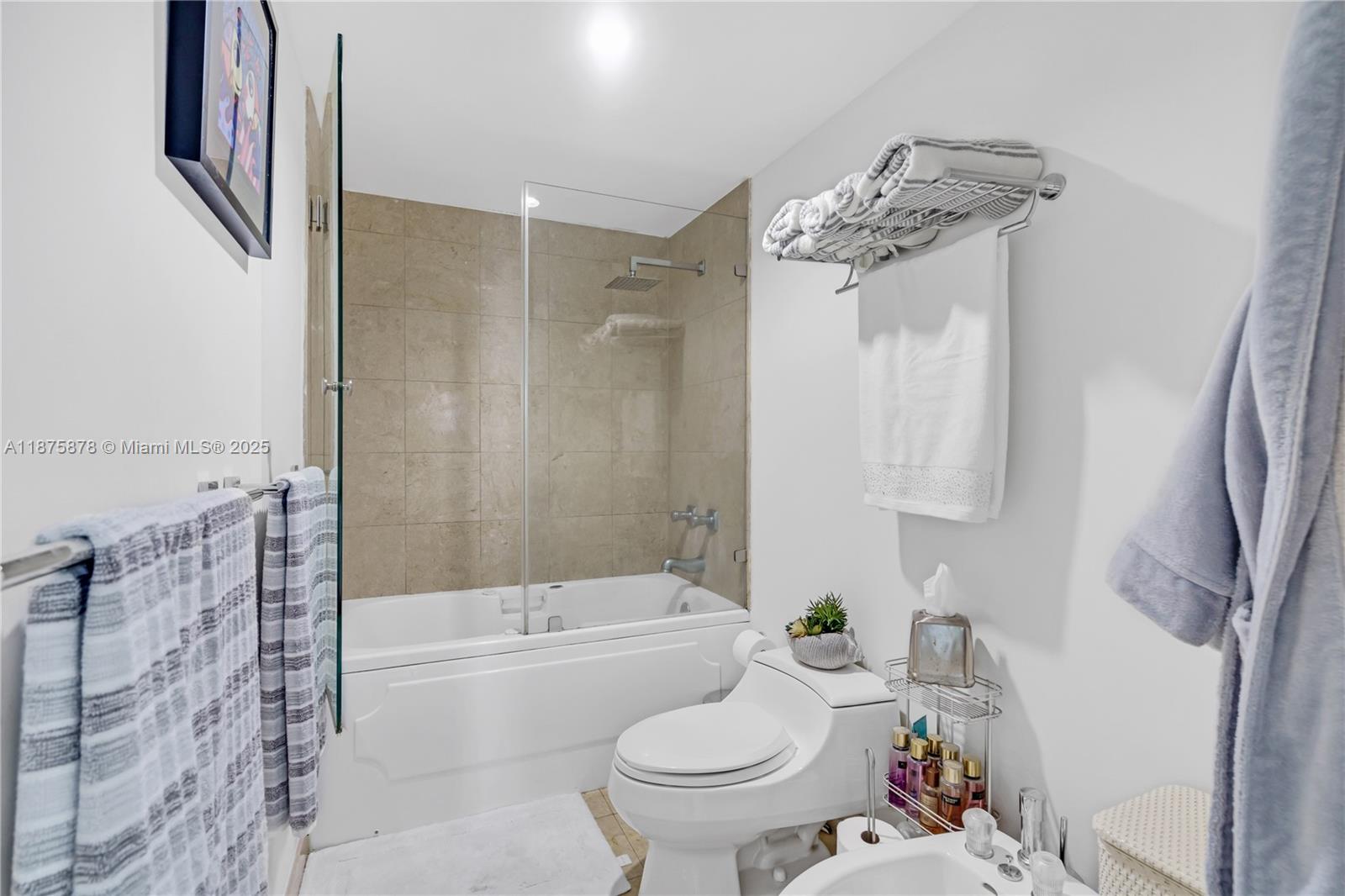 848 Brickell Key Drive, Unit 3803 Miami, FL 33131 - Photo 38 of 42 a bathroom with a sink toilet and shower