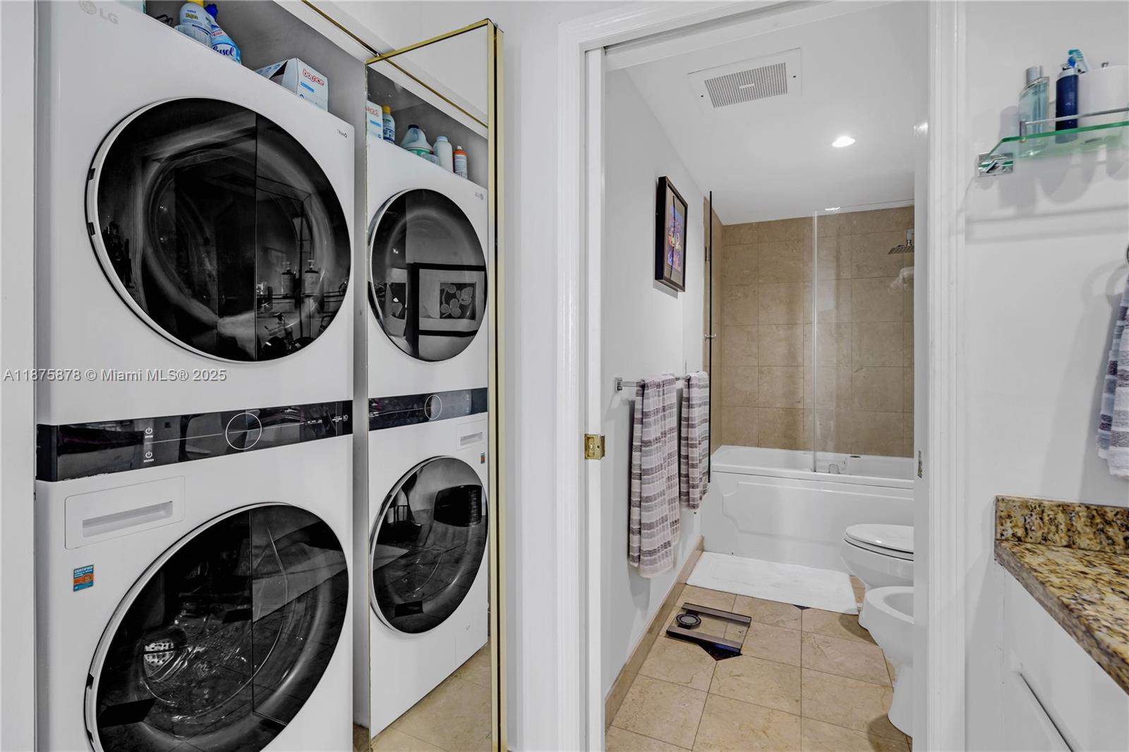 848 Brickell Key Drive, Unit 3803 Miami, FL 33131 - Photo 39 of 42 a view of livingroom with washer and dryer