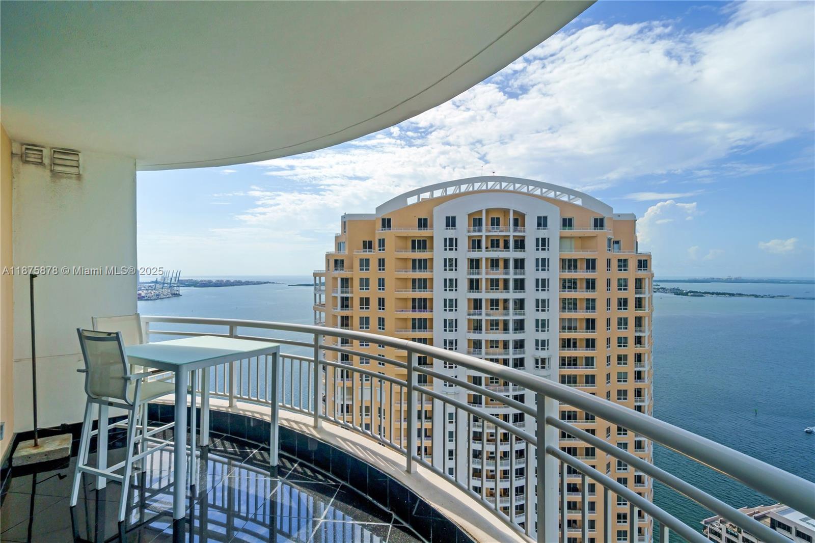 848 Brickell Key Drive, Unit 3803 Miami, FL 33131 - Photo 41 of 42 a view of a balcony with table and chairs