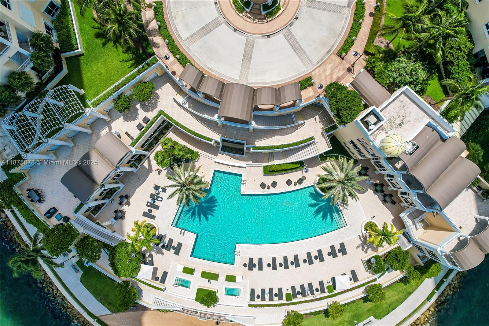 848 Brickell Key Drive, Unit 3803 Miami, FL 33131 - Photo 9 of 42 an aerial view of a house with a swimming pool and outdoor seating