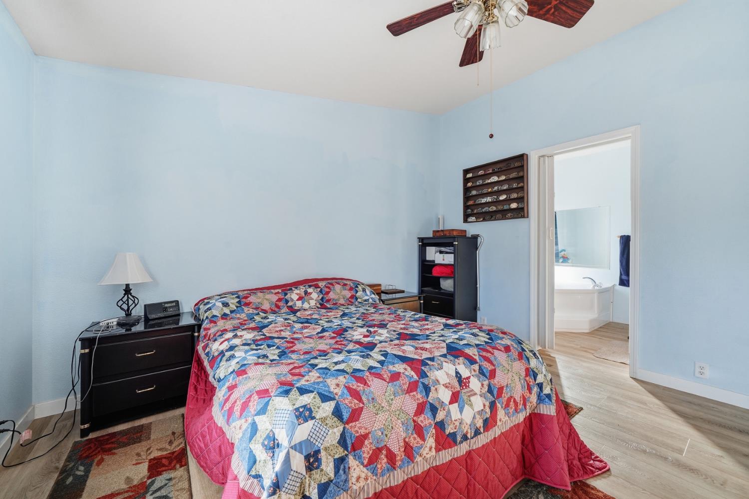 1400 West Marlette Street, Unit 33 Ione, CA 95640 - Photo 19 of 33 a bedroom with a bed and a book shelf