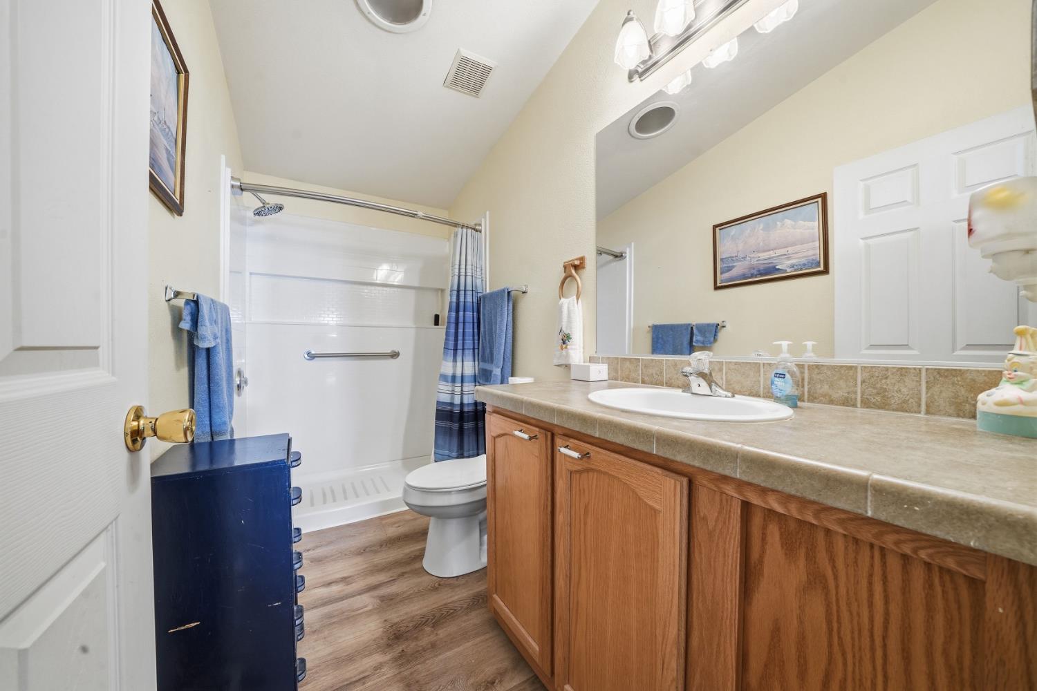1400 West Marlette Street, Unit 33 Ione, CA 95640 - Photo 23 of 33 a bathroom with a granite countertop sink toilet and shower
