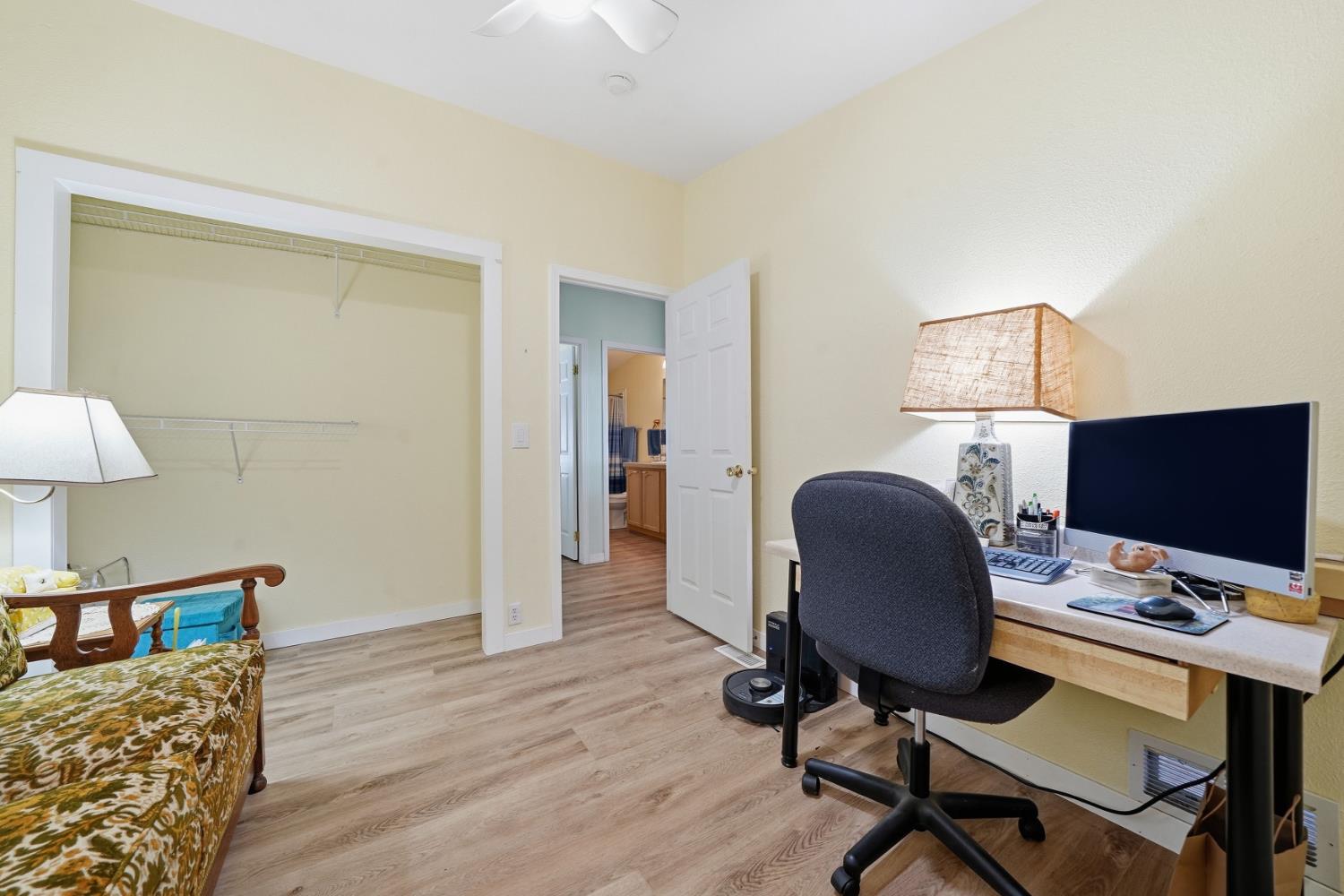 1400 West Marlette Street, Unit 33 Ione, CA 95640 - Photo 27 of 33 a view of a workspace with furniture and a lamp