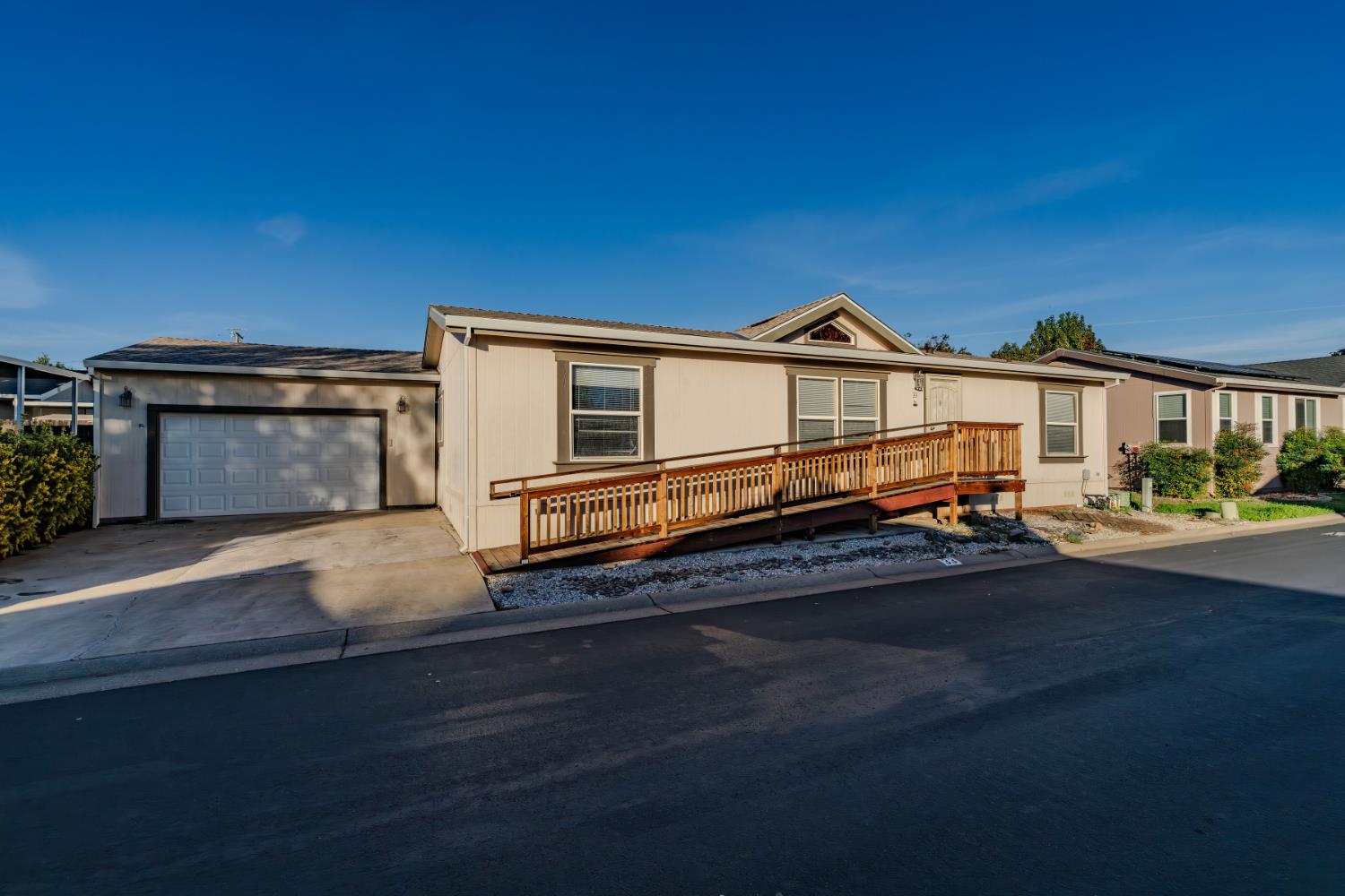 1400 West Marlette Street, Unit 33 Ione, CA 95640 - Photo 3 of 33 a front view of a house with a yard and garage
