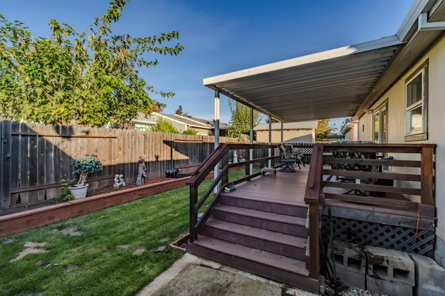 a view of a backyard with sitting area
