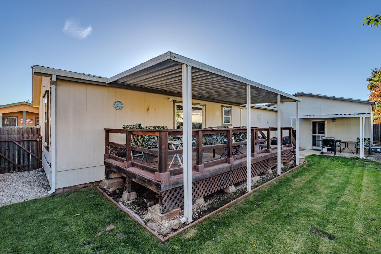 1400 West Marlette Street, Unit 33 Ione, CA 95640 - Photo 32 of 33 a view of a backyard with wooden deck and a garden