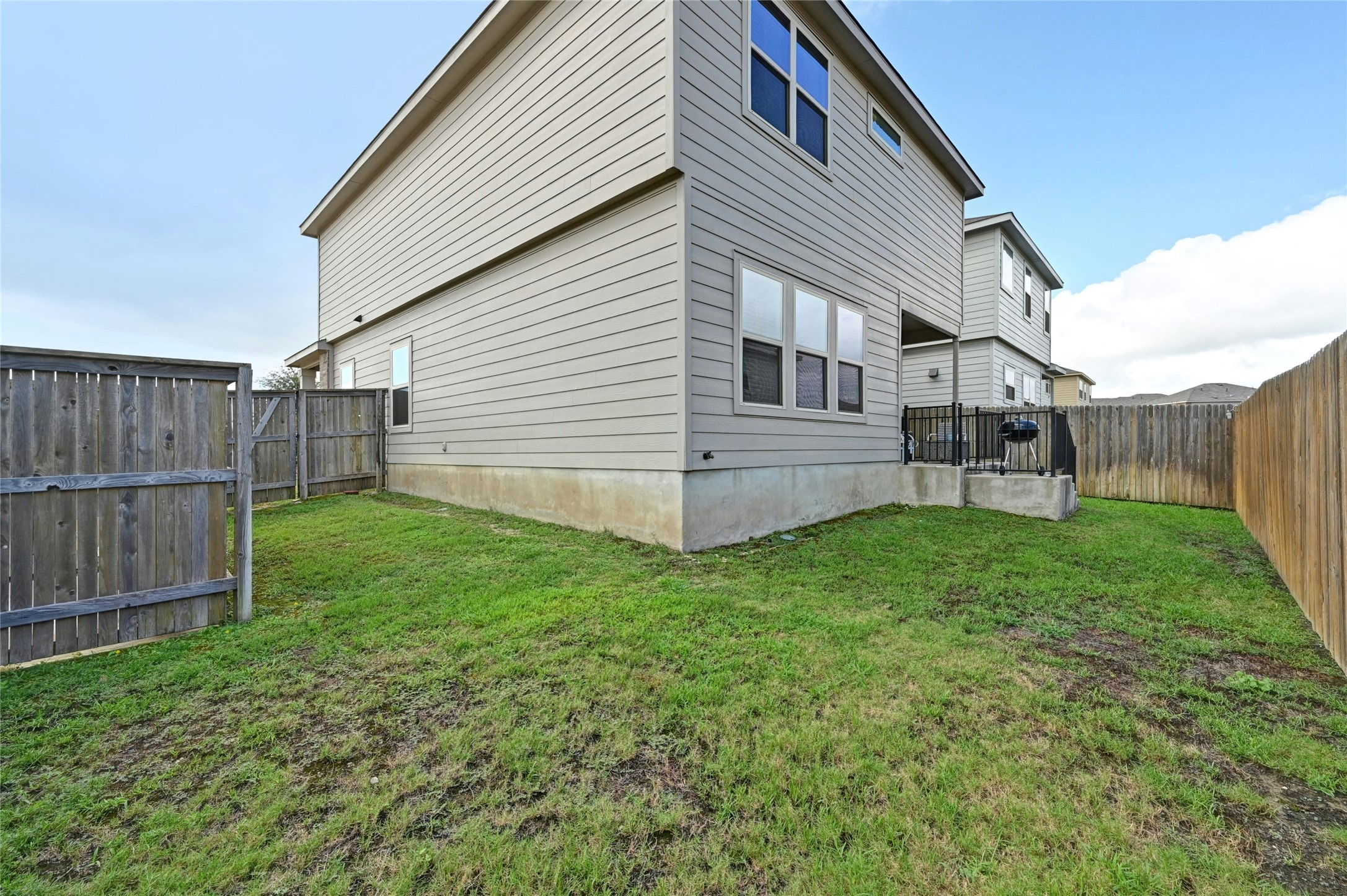 100 Comet Drive, Unit 1I Jarrell, TX 76537 - Photo 17 of 25 View of property exterior featuring a fenced backyard