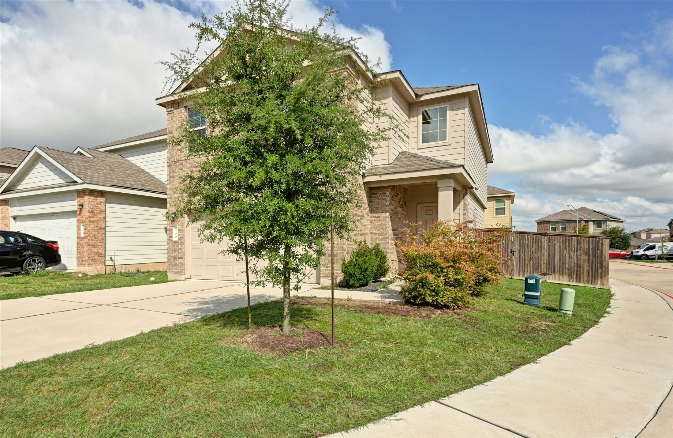 100 Comet Drive, Unit 1I Jarrell, TX 76537 - Photo 24 of 25 View of front facade featuring concrete driveway and brick siding