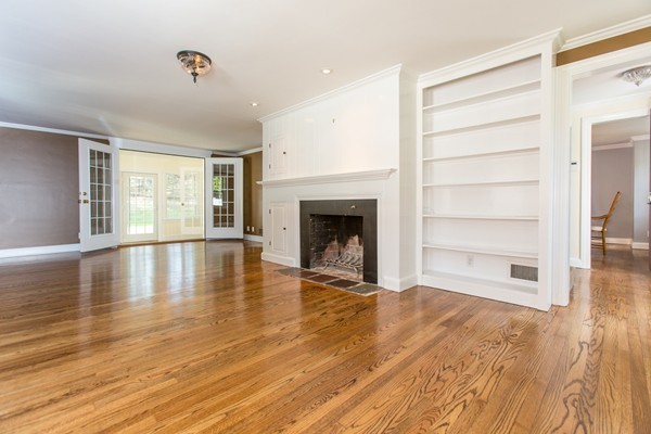 15 Priscilla Road Wellesley, MA 02481 - Photo 8 of 18 a view of empty room with wooden floor and fireplace