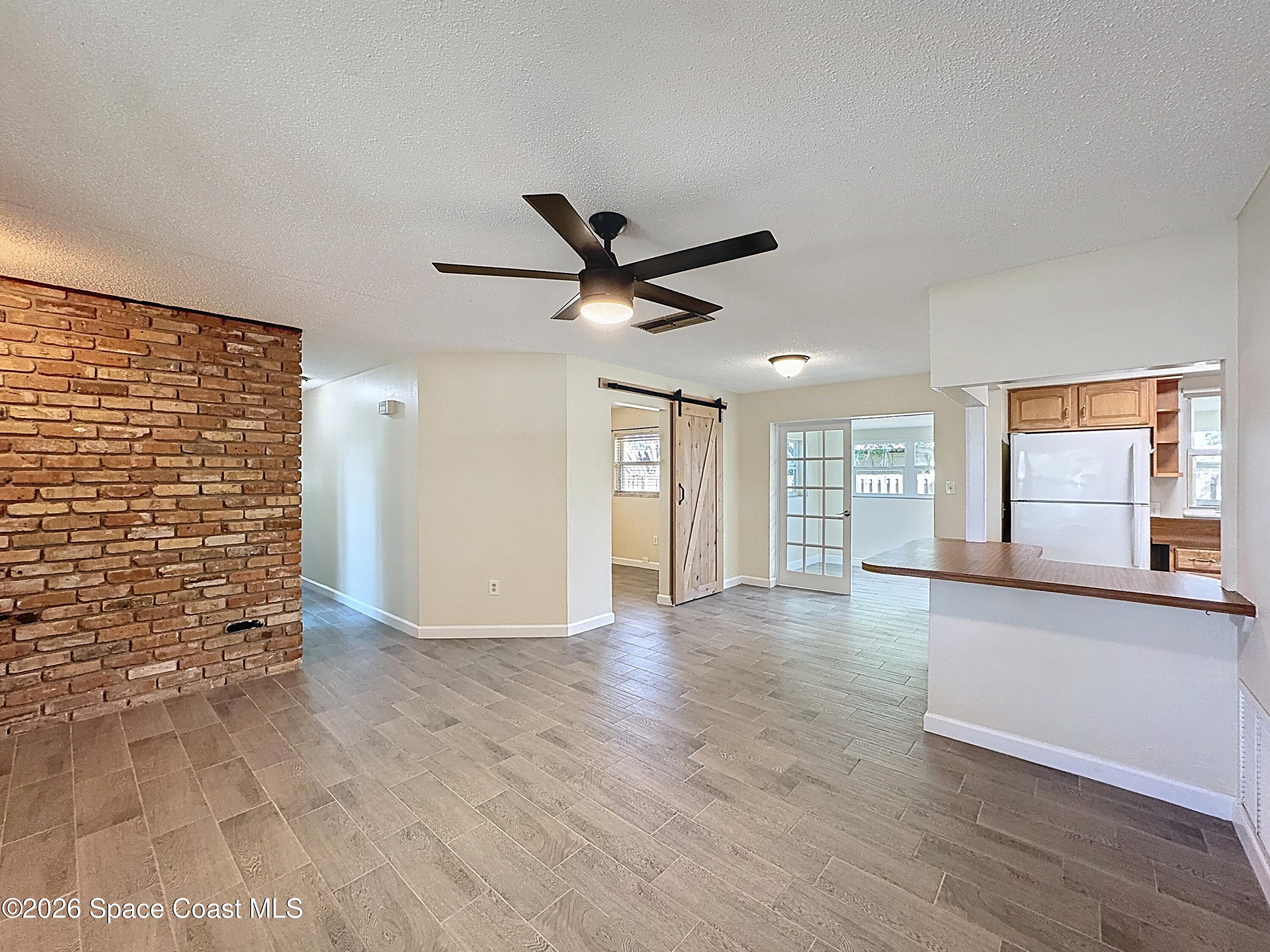 1315 Lester Court Merritt Island, FL 32952 - Photo 2 of 40 a view of an empty room with a window