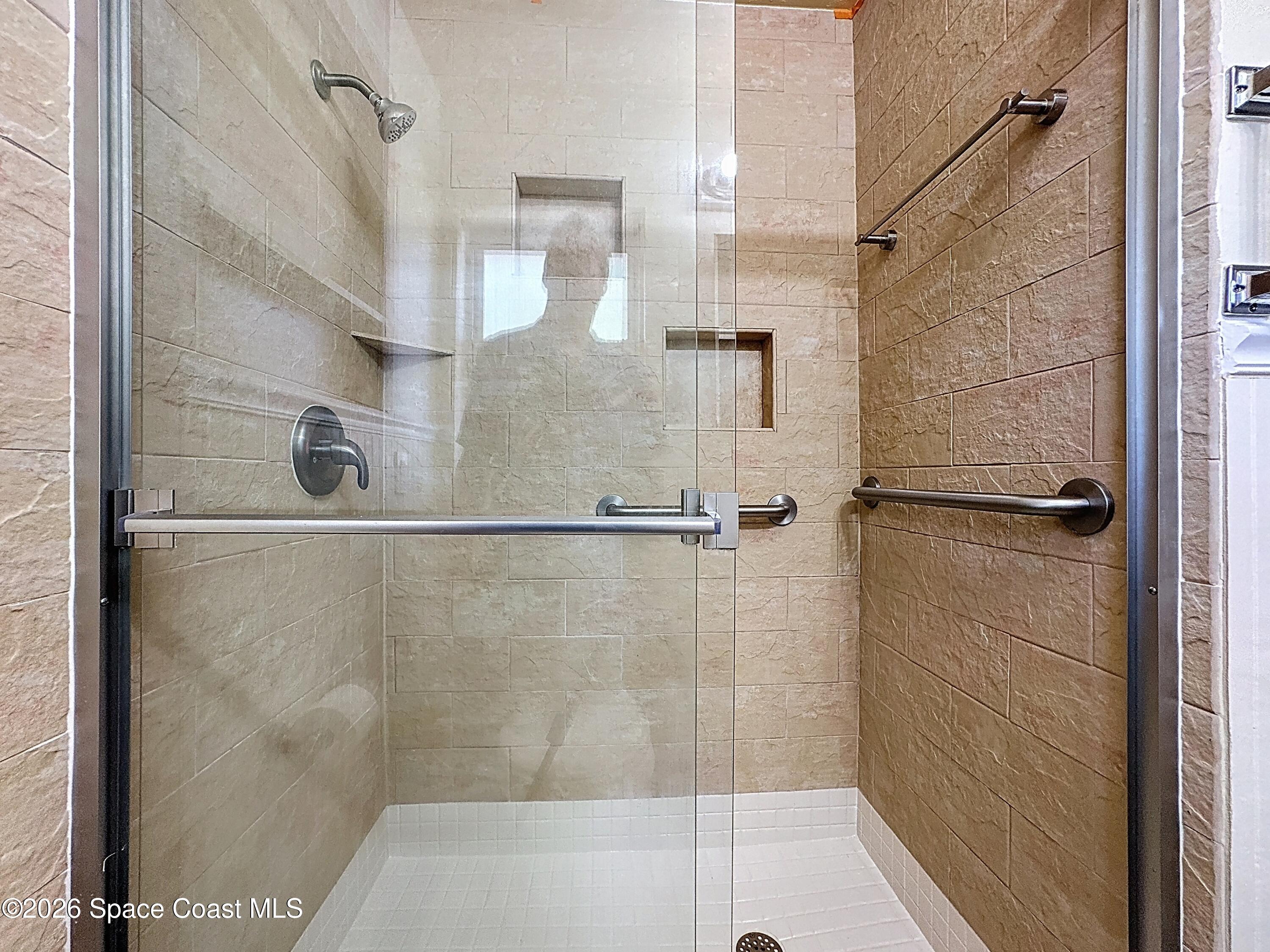 1315 Lester Court Merritt Island, FL 32952 - Photo 22 of 40 a bathroom with a shower