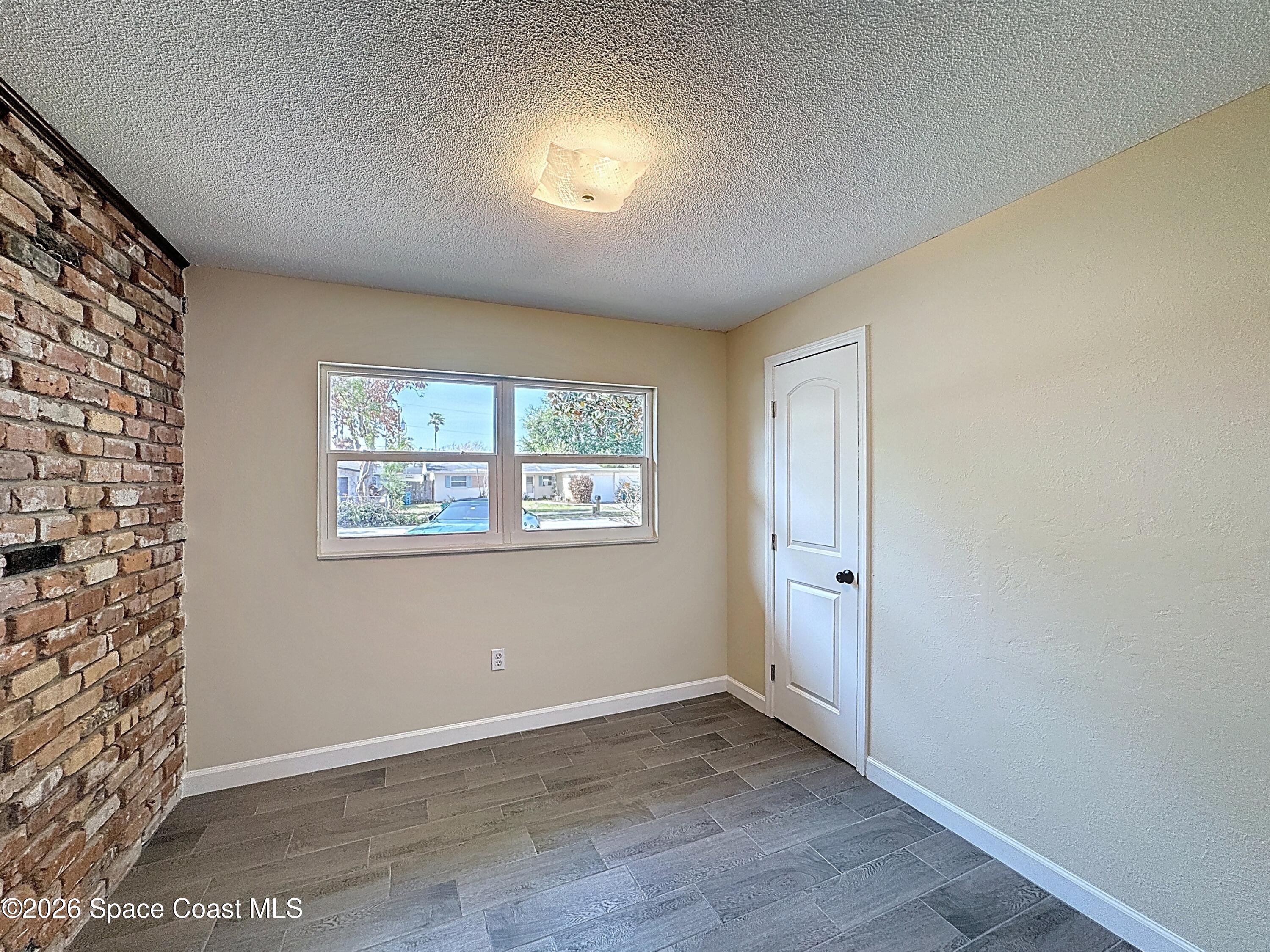 1315 Lester Court Merritt Island, FL 32952 - Photo 23 of 40 an empty room with windows