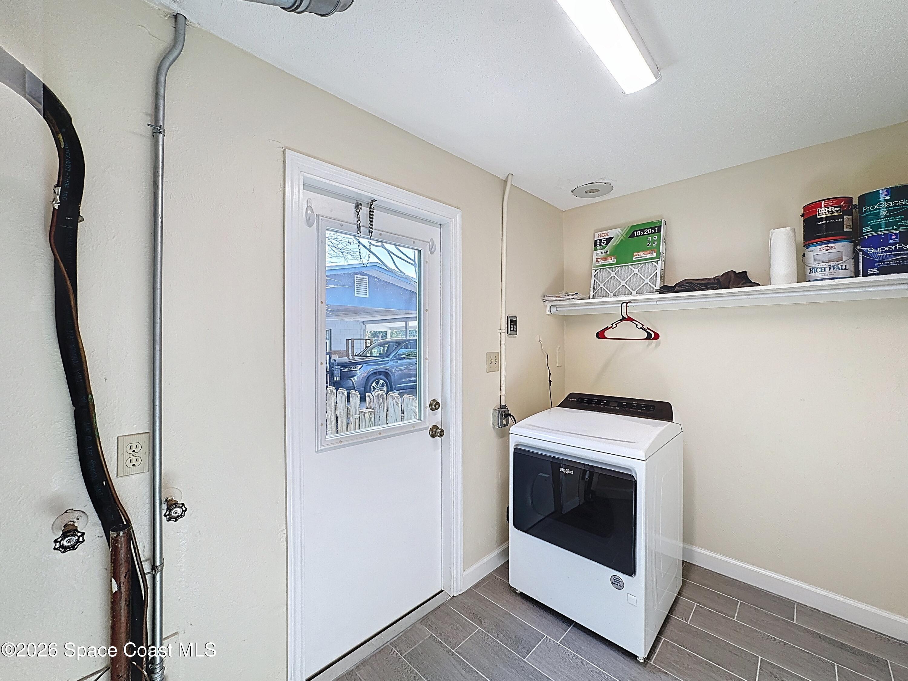 1315 Lester Court Merritt Island, FL 32952 - Photo 30 of 40 a utility room with dryer and washer