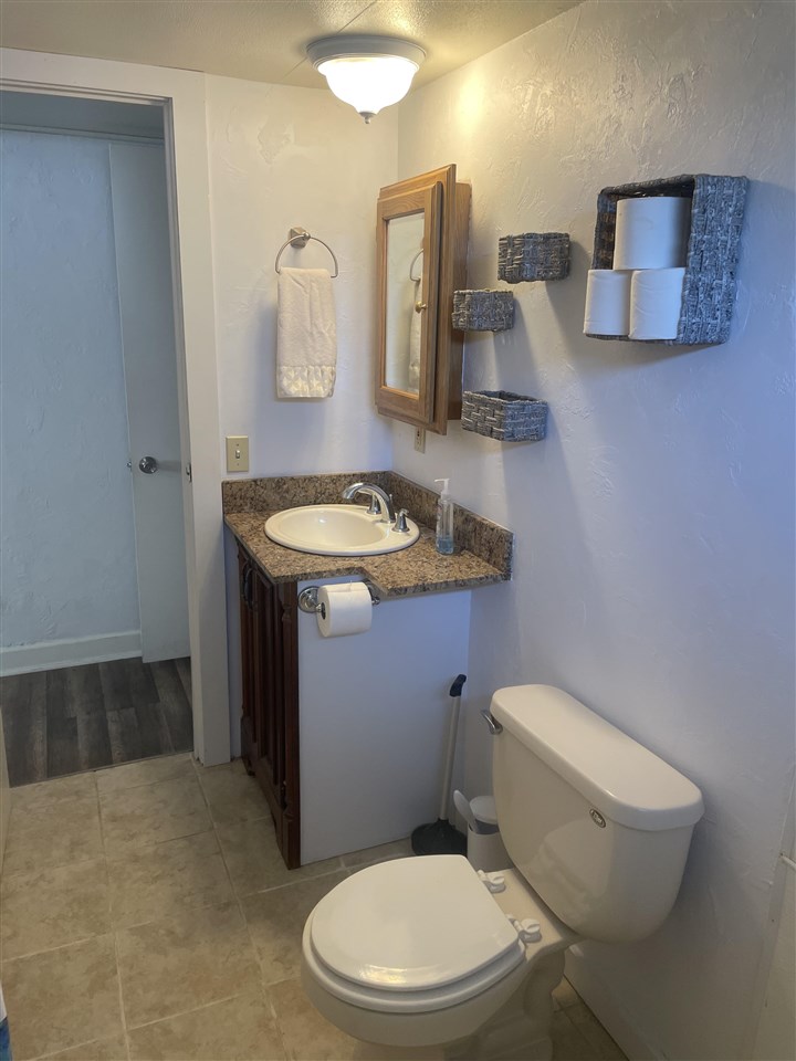3268 E Road, Unit 43 Clifton, CO 81520 - Photo 13 of 15 a white toilet sitting next to a bathroom sink